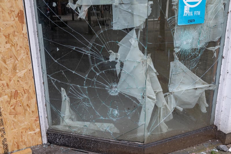 Smashed windows at the former Damart shop