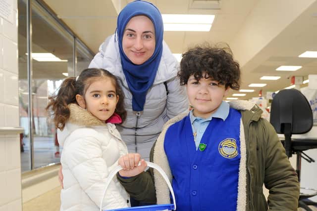 Sivar Haji with her daughter Lara Allaf, four, who goes to Arundel Court Primary Academy Nursery, with Year 5 pupil, Bow-Anne Shanahan, 10. Picture: Sarah Standing (060320-9575)