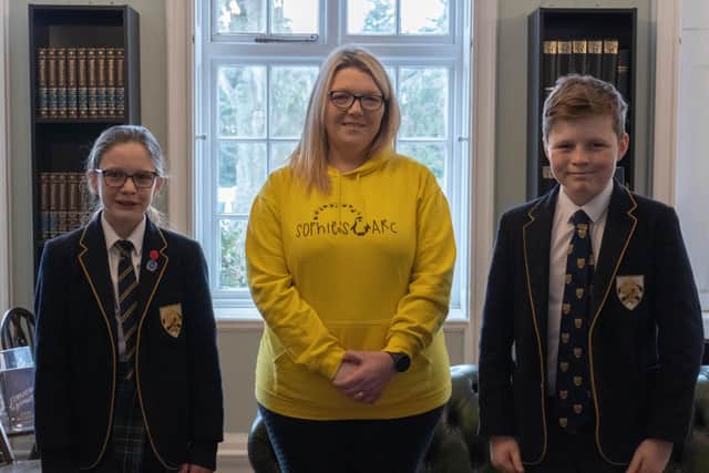 Charlotte Fairall with Boundary Oak School Charity Captains Mason Lowthian (Year 8) and Caliana Hynes-Wilmott (Year 6).