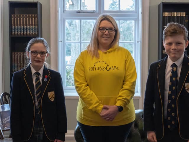 Charlotte Fairall with Boundary Oak School Charity Captains Mason Lowthian (Year 8) and Caliana Hynes-Wilmott (Year 6).