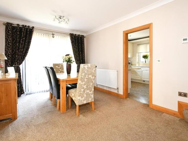 Our first look inside the house shows the delightful dining room. This leads to the kitchen on one side and the sitting room on the other.