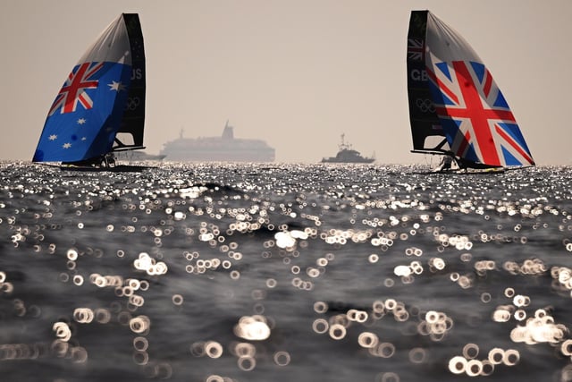 MARSEILLE, FRANCE - JULY 28: Jim Colley and Shaun Connor of Team Australia and James Peters and Fynn Sterritt of Team Great Britain compete in the Men's Skiff class on day two of the Olympic Games Paris 2024 at Marseille Marina on July 28, 2024 in Marseille, France. (Photo by Clive Mason/Getty Images)