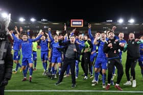 The Grimsby players and staff celebrate their FA Cup fifth round win against Southampton at St Mary's   Picture: ADRIAN DENNIS/AFP via Getty Images