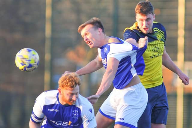Moneyfields' Bassy Stott wins this header against Denmead at Front Lawn. Picture: Martyn White