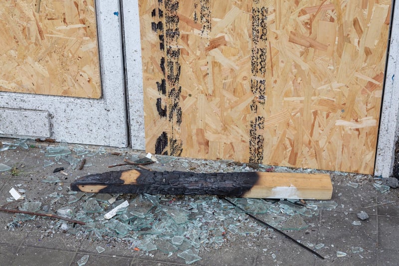 Charred wood in the doorway of the former Damart shop on Arundel Street