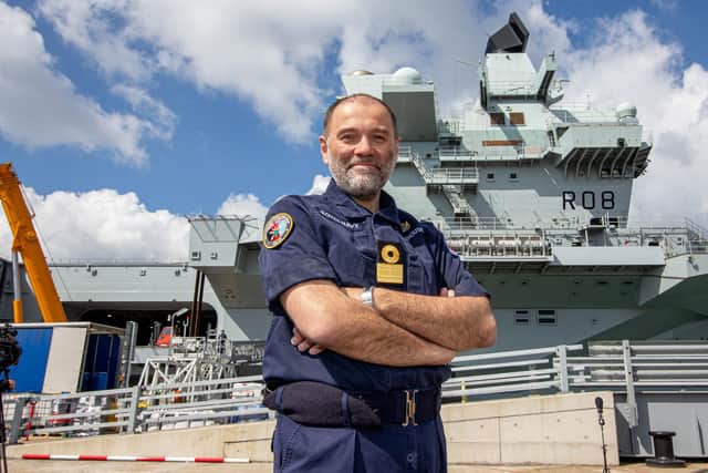 Pictured: Commodore, Steve Moorhouse in front of HMS Queen Elizabeth

Picture: Habibur Rahman