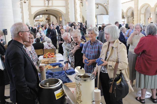 Archbishop of Canterbury Justin Welby serving soup to worshippers after a service in Portsmouth Cathedral in 2016.