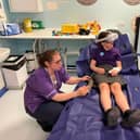 Eva and Children's Play Specialist, Zoe using the VR headset