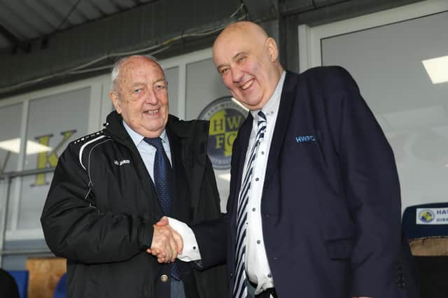 Hawks secretary Trevor Brock, right, with National League president Brian Lee after being presented with his FA Gold medal for long service to the game prior to the FA Cup win against Billericay at Westleigh Park.