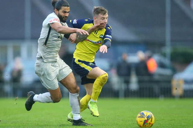 Mason Walsh battles for possession with Walton skipper Joshua Lelan. Picture: Chris Moorhouse