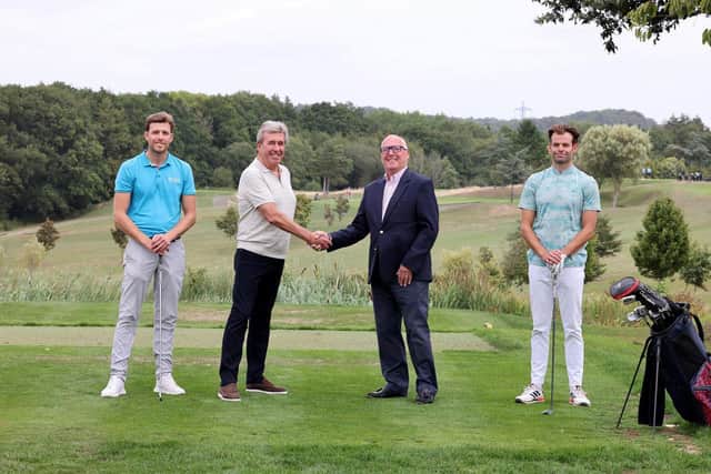 (l-r) Alex Bartlett, Russell Bartlett shaking hands with Alan Fisher from FAC and Ed Bartlett