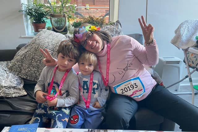 Rosa Lloreda with her boys after Race for Life 2021, one month after her mastectomy.