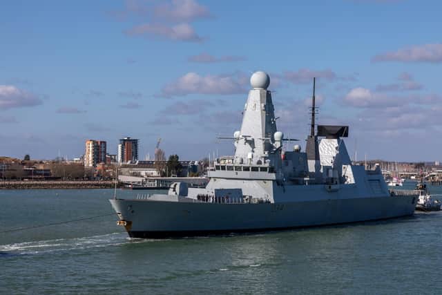 HMS Diamond leaves Portsmouth Harbour. Picture: Mike Cooter (250222)