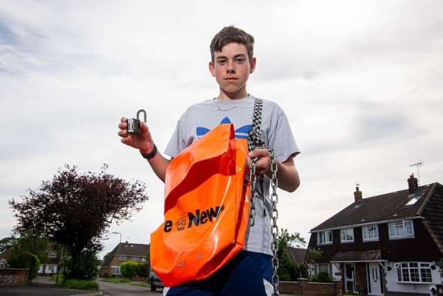 Spencer Cartwright with the chain that held his bike near his home in Waterlooville. Picture: Habibur Rahman