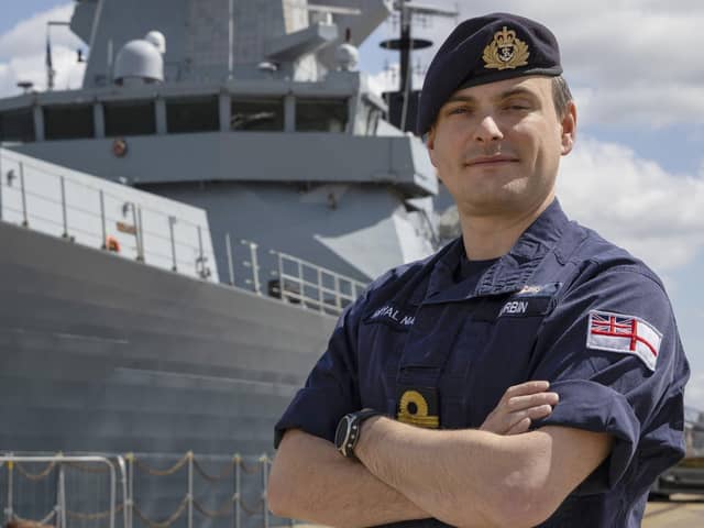 Portrait of Lt Cdr Will Durbin of HMS DuncanAwarded the Queen’s Commendation for Valuable Service in the Operational Honours, Lt Cdr Will Durbin poses today 12/05/22 on the North Jetty at HMNB Ports in front of HMS Duncan for his official portrait.Lt Cdr Durbin is to receive the award for his efforts in planning the aerial evacuation of civilians from Afghanistan during Op Pitting during the summer of 2021. Around 15,000 people were evacuated on around 100 flights over a 14-day period.
