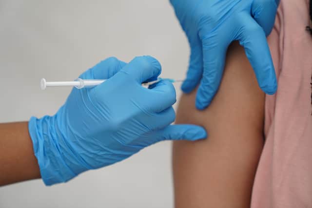 EMBARGOED TO 0001 SATURDAY MARCH 2 File photo dated 31/07/21 of a person receiving a Covid-19 jab. Bookings will open on Saturday for children aged five to 11 in England to get a Covid-19 vaccine. Issue date: Saturday April 2, 2022.
