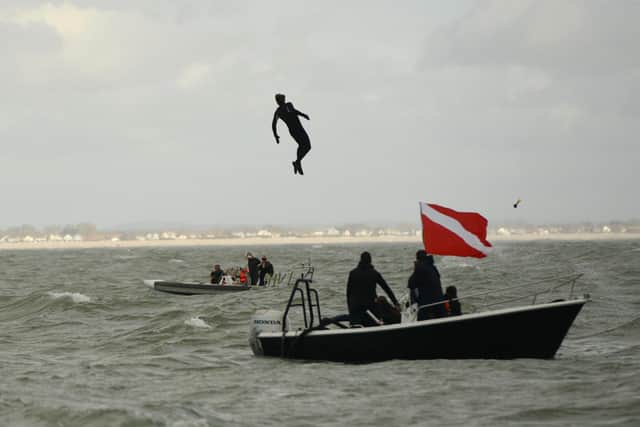 John Bream about to land in the water after jumping from the aircraft.
Picture: Ewan Galvin/Solent News & Photo Agency