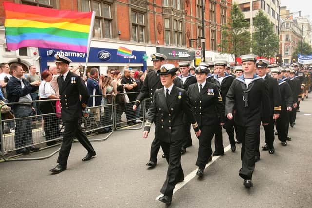 Military personnel take part in the Gay Pride parade in London.