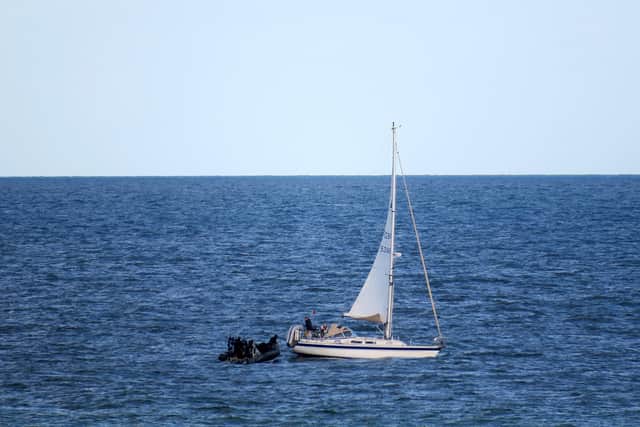 HMS Dragon comes to rescue of stricken yacht off a Dorset beauty spot.