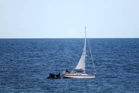 HMS Dragon comes to rescue of stricken yacht off a Dorset beauty spot.