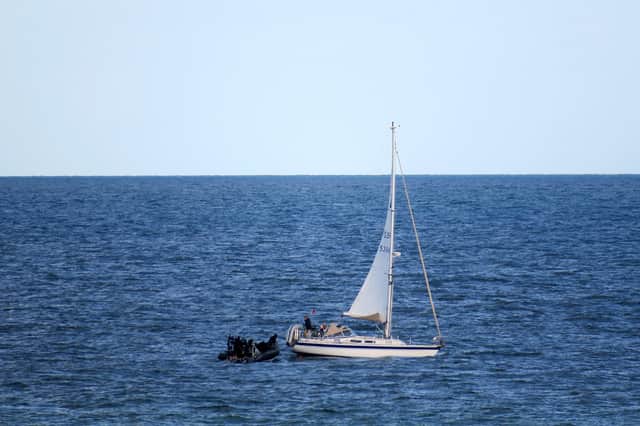 HMS Dragon comes to rescue of stricken yacht off a Dorset beauty spot.