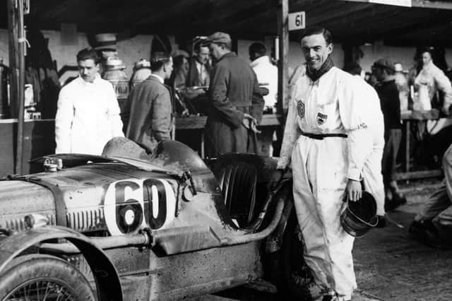 Freddie March standing by his MG Midget No. 60 in which he won the Double Twelve at Brooklands in 1931 and founded the Goodwood Motor Circuit in 1948. Picture: The News PP4799