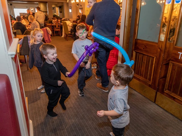 Theodore Legg (1) and Elijah Worrell (3) test out their balloon swords in battle. Picture: Mike Cooter (040323)