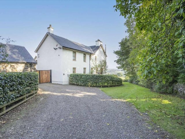 Driveway to gated entrance.