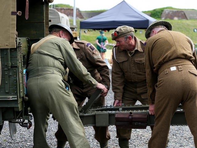 Garrison Artillery Volunteers attach a gun to a truck.