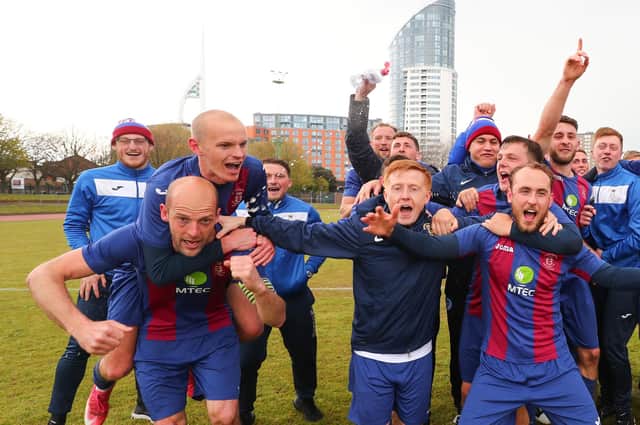 Tom Jeffes, left, gives Harry Birmingham a piggyback after US Portsmouth's FA Vase victory against Flackwell Heath. Picture: Stuart Martin