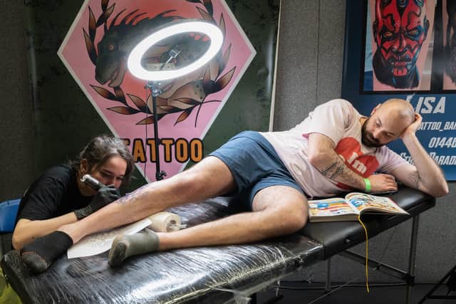 The Mountbatten Centre held the two day event which gathered together more than one hundred world-class tattoo artists. In this picture Kit Wagstaff works on the leg of Yohan.Picture taken last year 

Picture: Keith Woodland