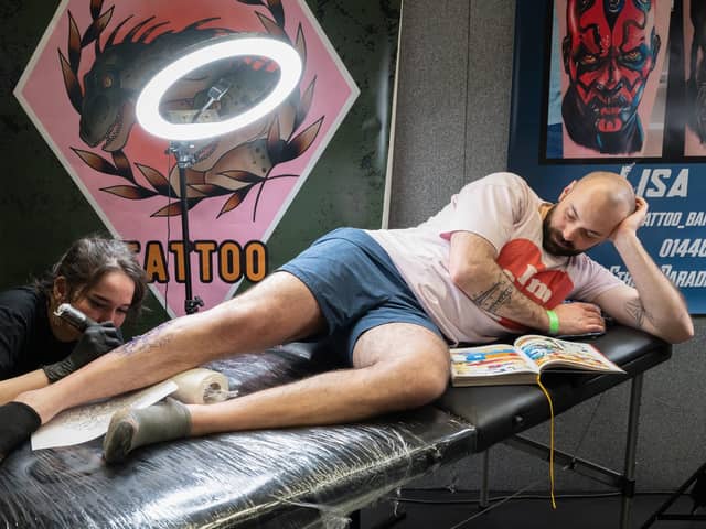 The Mountbatten Centre held the two day event which gathered together more than one hundred world-class tattoo artists. In this picture Kit Wagstaff works on the leg of Yohan.
Picture from last year. 
Picture: Keith Woodland