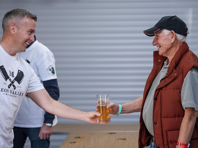 Joe Lane, left, hand Roger Lunn his cider. Wickham Beer Festival, Wickham Community CentrePicture: Chris  Moorhouse (051024-058)