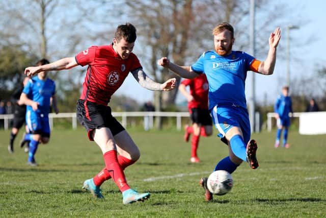 Connor Hilton, left, and Luke Heard, Locks Heath v Fleetlands (blue).
Picture: Chris Moorhouse