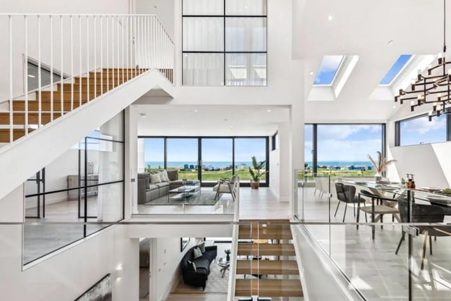 The listing says: "With perfect views over the Solent to the Isle of Wight, a beautiful and unique, new detached house and gardens of outstanding design on the sea front. Sea Point stands on the sea front of the southernmost beach of Hayling Island."