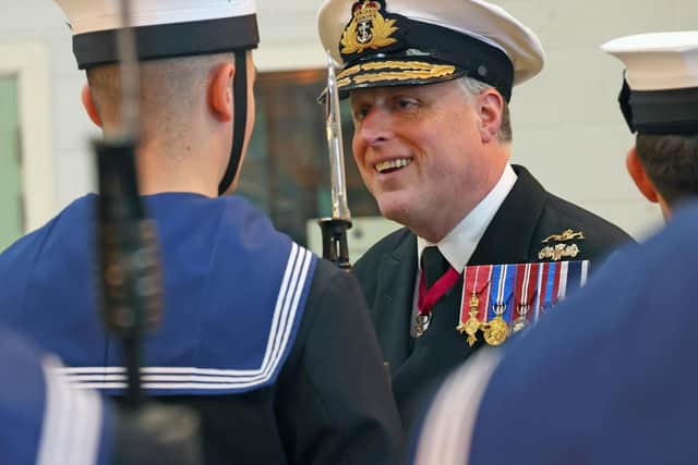 Rear Admiral Simon Asquith inspects the Guard of Honour at HMS Sultan