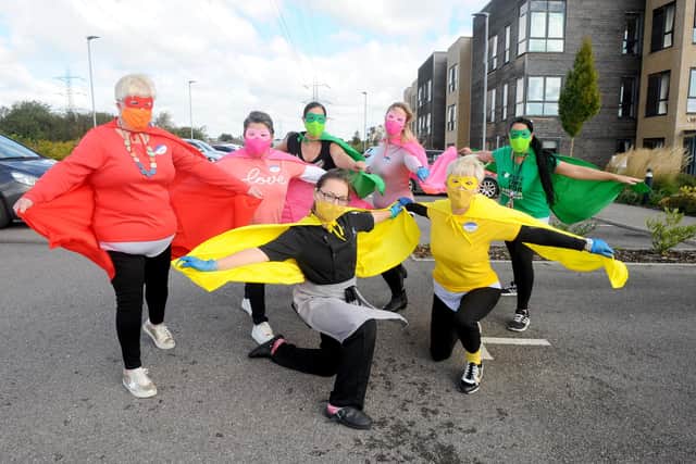 Staff at Wellington Vale Care Home in Waterlooville, dressed up as superheroes and served cake and coffee in a drive thru coffee morning for Macmillan Cancer Research on Friday, September 25.
Pictured is: Staff from Wellington Vale (back l-r) Angela Delarmente, care services manager, Lisseth Mendonca, hospitality manager, Tracey Craggs, administrator and Breda O'Doherty, activities manager with (front l-r) Sue Hill, general manager, Ellie Aldred, kitchen assistant and Helen Dunning, home admissions advisor.
Picture: Sarah Standing (250920-4567)