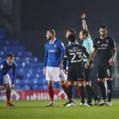 Jack Whatmough was shown a straight red card in the first half of tonight's Fratton Park clash with Lincoln. Picture:  Joe Pepler
