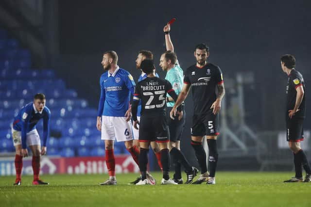 Jack Whatmough was shown a straight red card in the first half of tonight's Fratton Park clash with Lincoln. Picture:  Joe Pepler