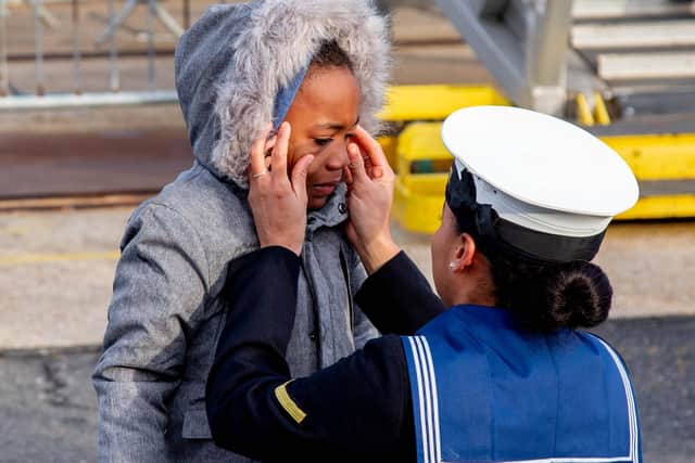 Pictured: Sharisia Clarke pictured wiping the tears away from the eyes of her son, Jamane, six.
Picture: Habibur Rahman