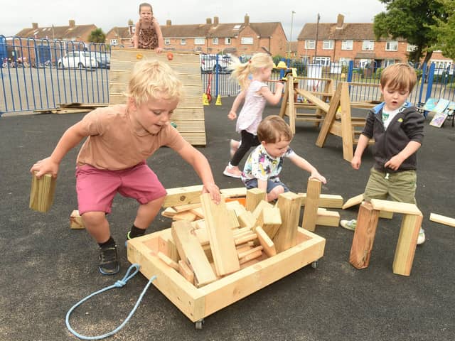 Havant Men's Shed have built St Thomas More's Nursery School in Behampton, new climbing equipment for the children to support their physical development and social skills after the pandemic. From left: Maximus Davison (four), Samuel Minnis (four), and Harrison Hill (three). Picture: Sarah Standing (240622-877)