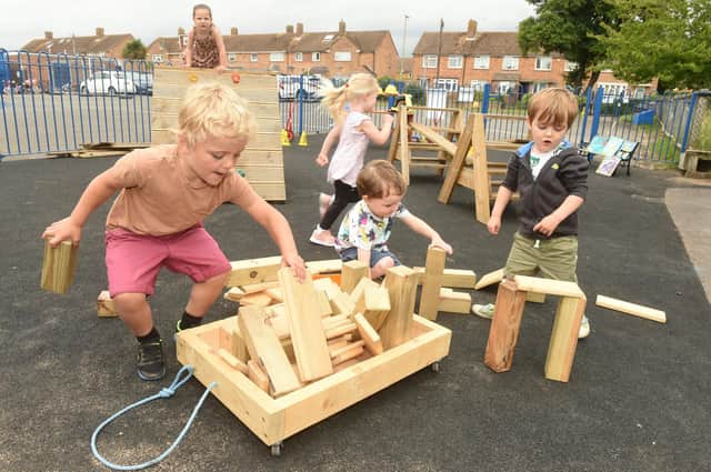 Havant Men's Shed have built St Thomas More's Nursery School in Behampton, new climbing equipment for the children to support their physical development and social skills after the pandemic. From left: Maximus Davison (four), Samuel Minnis (four), and Harrison Hill (three). Picture: Sarah Standing (240622-877)