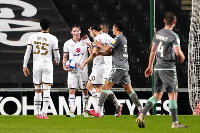 Mk Dons' Joe Mason clutches the match ball following his 28-minute hat-trick against Fleetwood on Tuesday night. Picture: Zac Goodwin/PA Wire