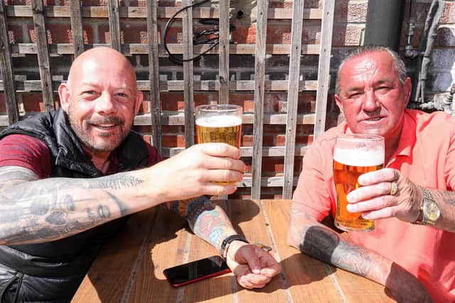 Mike Laybourne, left, and David Tee. Drinkers enjoy the sunshine at the Parchment Makers, Havant
Picture: Chris Moorhouse (jpns 240421-15)