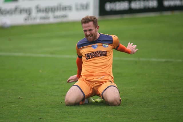 Theo Widdrington celebrates after scoring Hawks' third goal in their FA Cup win at Bath City. Pic: Kieron Louloudis.