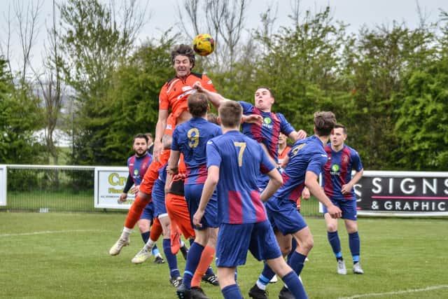 Lewis Fennemore rises highest for AFC Portchester in their friendly loss to US Portsmouth. Picture: Daniel Haswell.