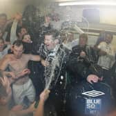 Lovely bubbly - Shaun Gale (foreground) is sprayed with champagne after Hawks beat Swansea in the FA Cup in January 2008 - now he is aiming to mastermind Gosport's win against higher tier Hereford in the same competition. Pic: Dave Haines.