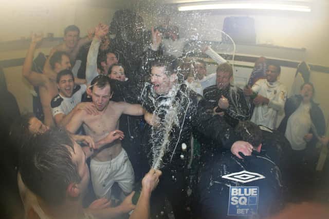 Lovely bubbly - Shaun Gale (foreground) is sprayed with champagne after Hawks beat Swansea in the FA Cup in January 2008 - now he is aiming to mastermind Gosport's win against higher tier Hereford in the same competition. Pic: Dave Haines.