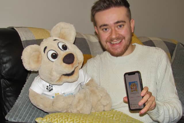 Tom Ingram has released a charity single by Karen Ingram Foundation mascot Muddles the Bear to raise funds. Pictured: Tom and Muddles