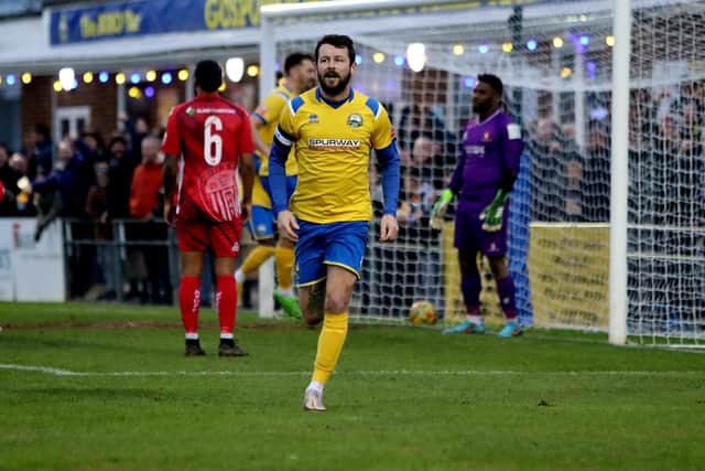 Dan Wooden wheels away after his stoppage time leveller. Picture by Tom Phillips